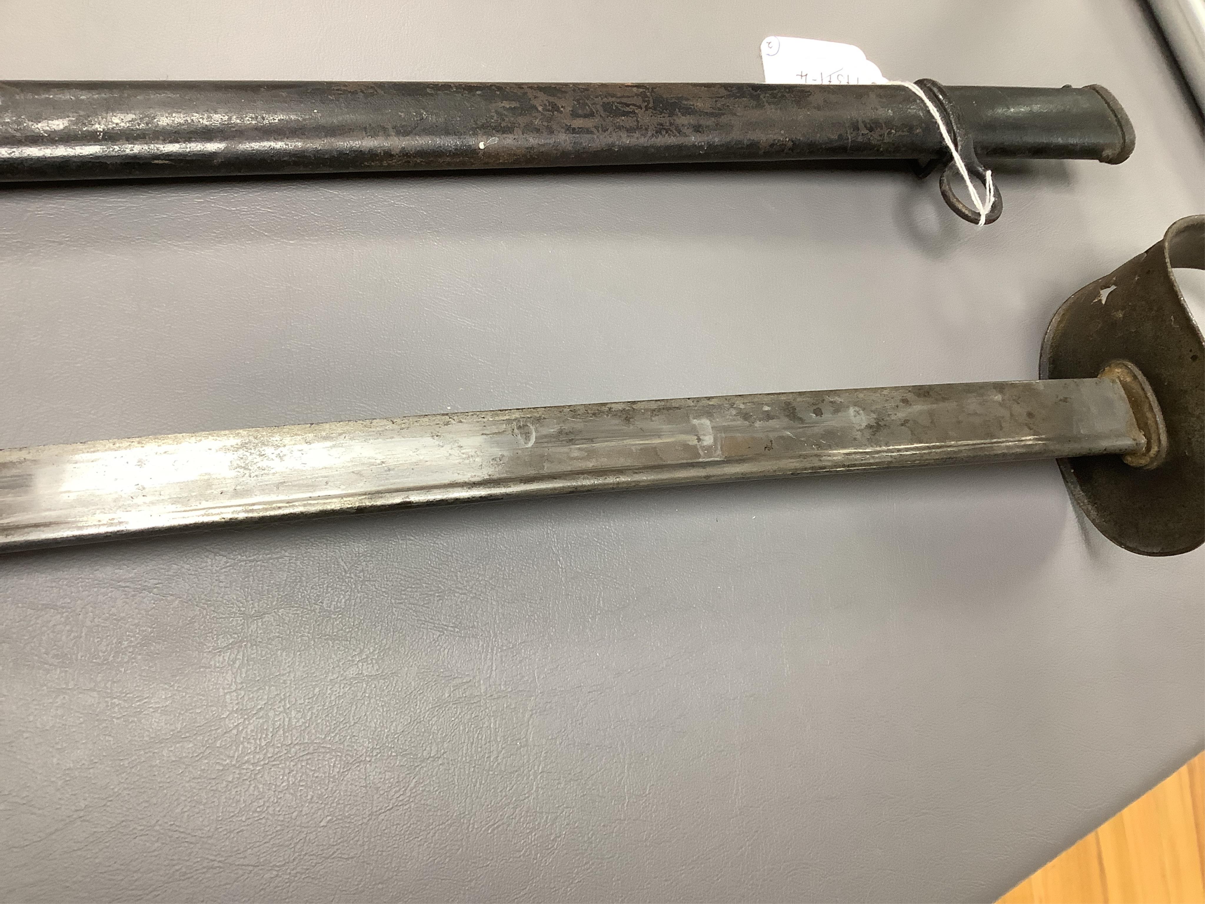 A First World War Turkish army officer’s sword, with pipe back blade, regulation iron guard pierced with crescent and moon, chequered horn grips, in its iron scabbard, together with an unidentified bayonet in its scabbar